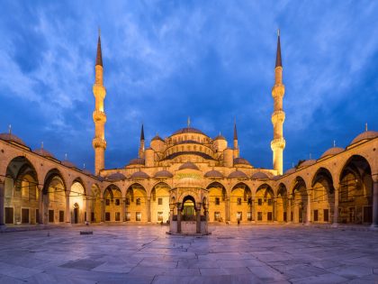 Wide angle view of the inner courtyard of the Sultan Ahmed Mosque (aka the Blue Mosque) at dusk, in Istanbul, Turkey.